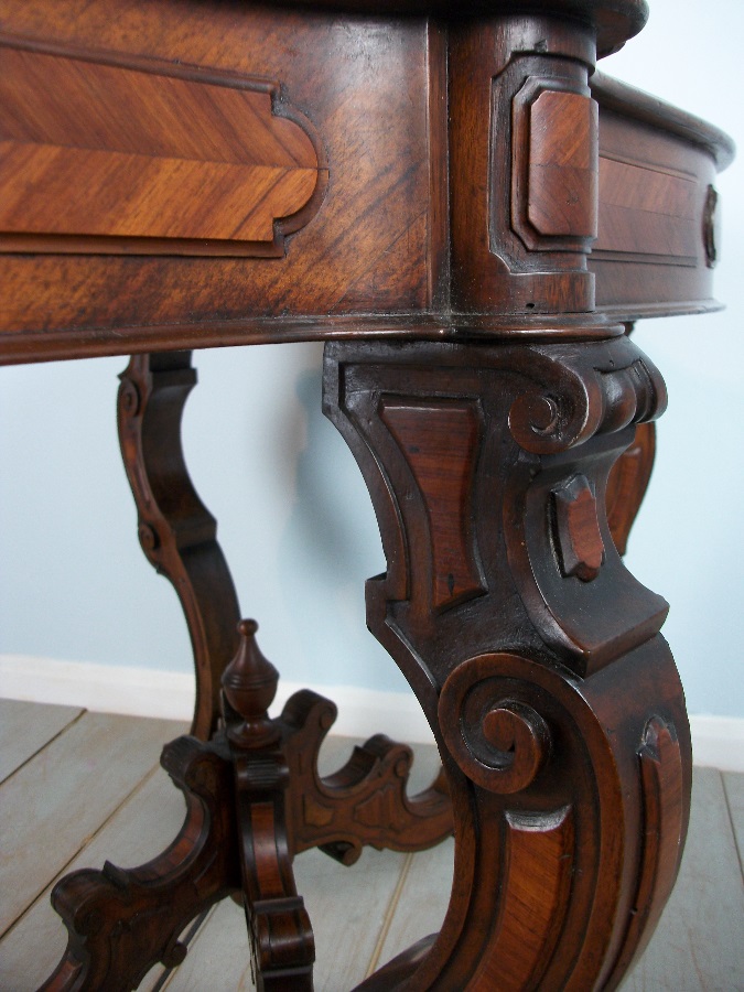 Antique Italian Occasional Table with profusely carved and shaped legs 